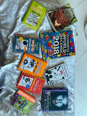 Collection of reading books - wimpy kid , Guiness world record , fiction books , bugs encyclopedia