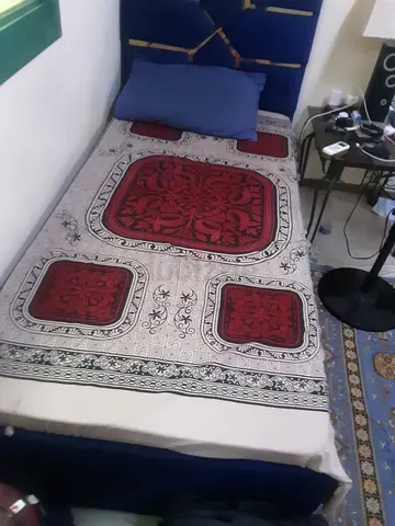 Single bed with mattress and decorative headboard - used, good condition.Urgent sale