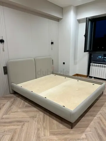 Modern low-profile upholstered double bed frame in light grey