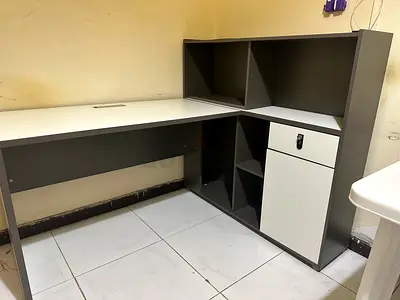 White + Grey L-shaped office table with shelf