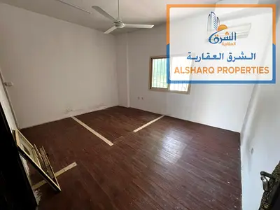 Studio apartment for annual rent in Al Liwarah, second row from Ajman Corniche, ground floor, split AC, AED 17,000 payable in 4 installments. Prime lo
