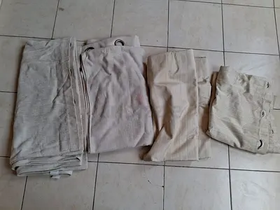 Set of beige eyelet curtains (4 panels) - good condition with rods