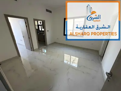 Brand new 1BHK in Al Aaliya, master room, 2 bathrooms, balcony and central AC.