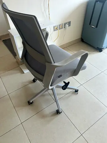 Grey ergonomic office chair on wheels - good condition