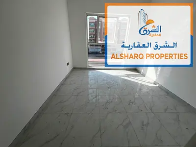 Al Muwaihat 3 - Two master bedrooms, 3 bathrooms, balcony with a distinctive view, spacious areas, modern finishes, central air conditioning