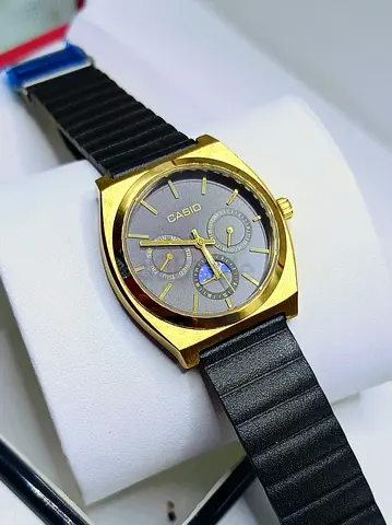 Casio gold-tone analog wristwatch with black strap - working