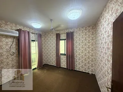 For rent: a -bedroom apartment with a living room in the Al Boutaina area, Sharjah.