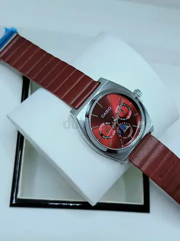 Casio men's wristwatch with red dial and brown leather strap