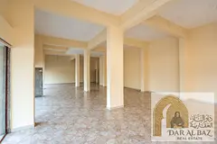 Large commercial shop with mezzanine in Al Majaz | 6 months free rent | Near Al Wahda Street | Near