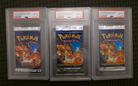 Three PSA-10 1999 Pokémon (2 Base Set and 1 Shadowless Edition Charizard Booster Packs)