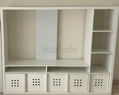 White multi-compartment entertainment / storage unit with boxes
