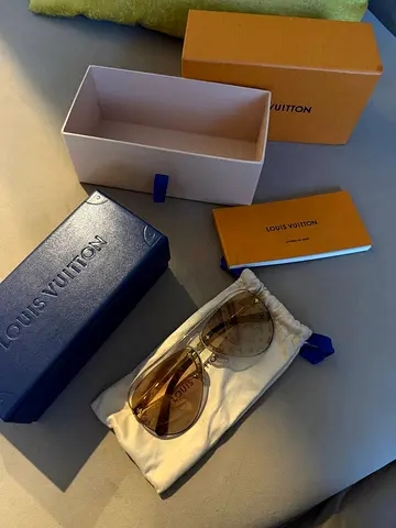 Louis Vuitton designer sunglasses with original box and pouch