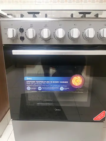 Midea freestanding gas range with oven - stainless steel, light usage