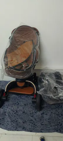 Stylish brown baby stroller (parts wrapped) - good condition aed 600