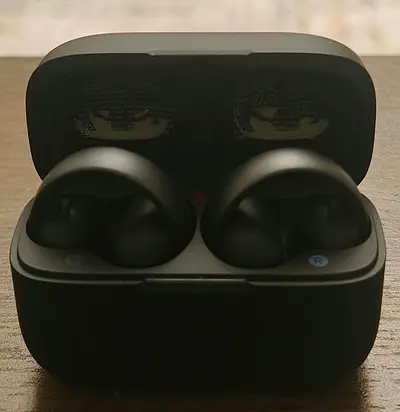 Pair of black true wireless earbuds with charging case - good condition
