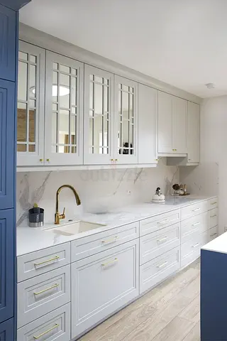 Custom built-in kitchen cabinets with marble countertop and brass handles | Custom made kitchen