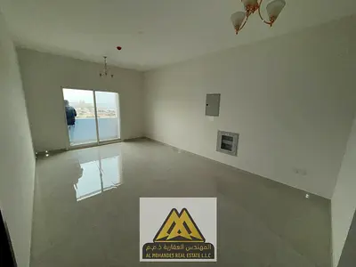 1BR near Ajman Corniche, master room, 2 baths, sea view, free parking, central AC, AED 38K.