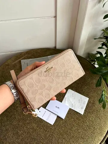 Coach zip-around leather wallet in beige