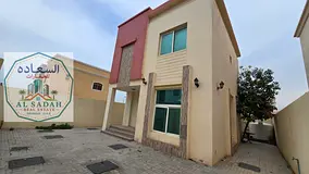 Two-story villa for sale in Al Fisht area, Sharjah, close to the sea. It features three bedrooms (on