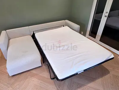 L-shaped sofa bed with chaise, pull-out mattress - good condition