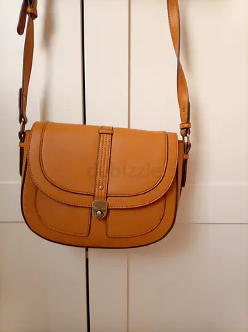 Accessorize. Mustard colored Outer: 100% Polyurethane. Crossbody saddle bag - flawless condition