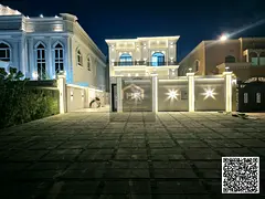 Luxury residential/commercial villa for sale in Al Muwaihat 1, with an outdoor majlis and 20-meter f