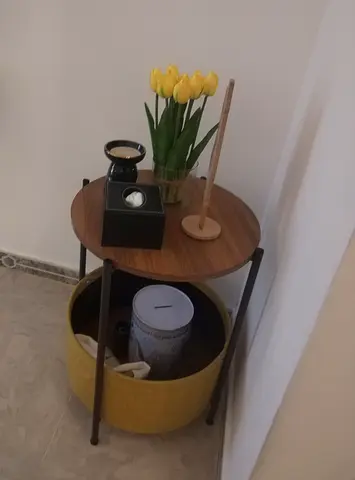 Small round wooden side table with storage basket - good condition each 100 AED