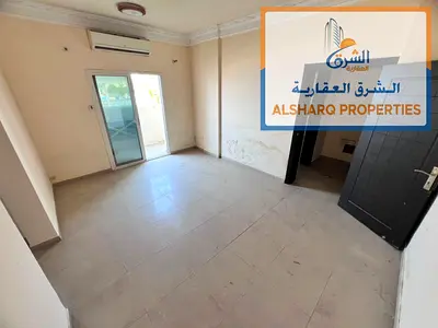 Balcony with an open view - 2 kitchens - Separate living room - Split AC - Prime location near all services on Al Mina Street