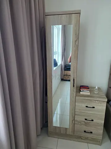Tall wooden dressing cum storage cabinet with full-length mirror and drawers - light oak finish