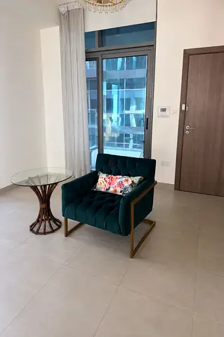 Green Velvet Armchair and Round Glass Side Table