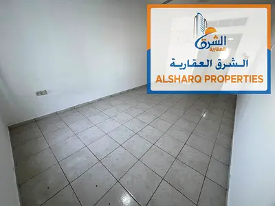 Spacious studio apartment with a semi-separate kitchen and central air conditioning for annual rent in Al Nuaimiya 2, Ajman. Easy access to Dubai and