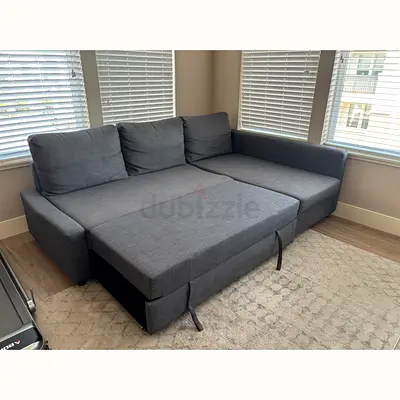 Grey L-shaped sofa bed with storage - good condition