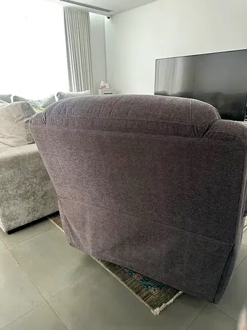 Comfortable dark grey upholstered recliner armchair - single seater
