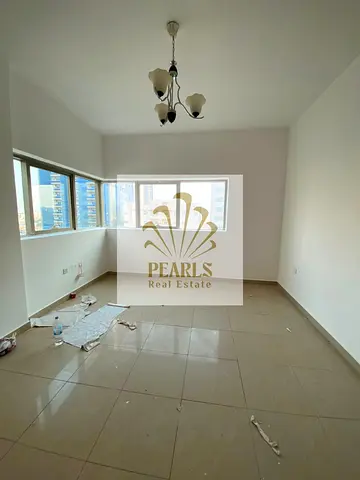 Annual rental in Al Rashidiya 3: 3BR apartment with open Sheikh Khalifa view, 2 master bedrooms, 2 balconies, 4 baths, free AC. AED 60K, 4–6 payments,