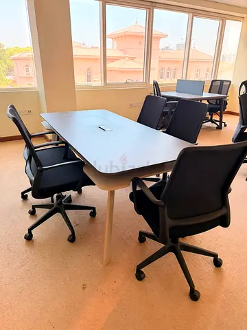 Office meeting table with 4 ergonomic swivel chairs - good condition