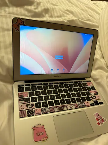 Silver Apple MacBook Air with Decorative Stickers