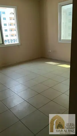Now available for annual rent in Al Qulaya: a two-bedroom apartment with a living room for only AED 38,000. Prime location near Sharjah Corniche.