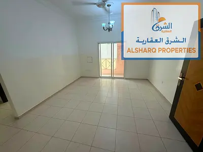 Two bedrooms and a living room in Ajman Industrial Area Next to Day to Day On Al Ittihad Street Central air conditioning Balcony with an open view