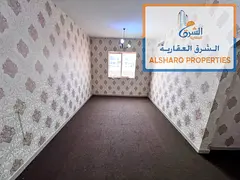 Two-bedroom apartment with a living room for annual rent in Al Rawda 2- Ajman, directly on Sheikh Am