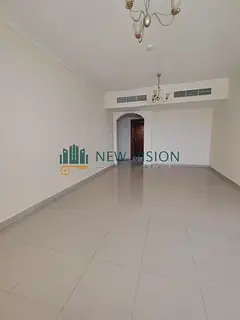 2BR in Al Majaz 1, sea view, kitchen balcony, central AC, free parking, built-in wardrobes, 2 baths.