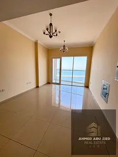 Two bedrooms and a living room with a distinctive sea view, in a strategic location opposite Ajman P