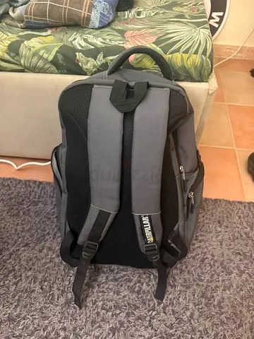 Grey rugged backpack with padded straps - good condition
