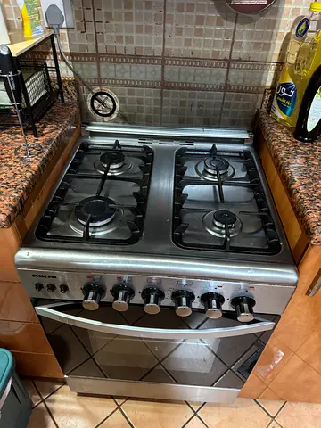 Built-in stainless steel gas oven with stovetop — good working condition