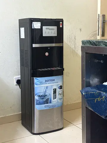 Used stainless steel water dispenser - bottom load, good working condition