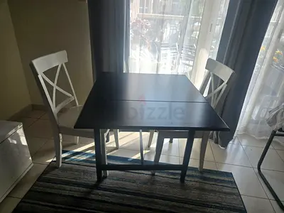 IKEA black Ingatorp 2 leaf drop table with drawer plus 2 white wooden chairs