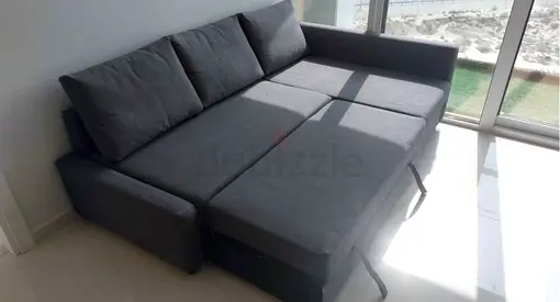 Grey fabric sofa bed with storage