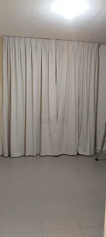 Full-length beige fabric curtains - ready to hang, good condition