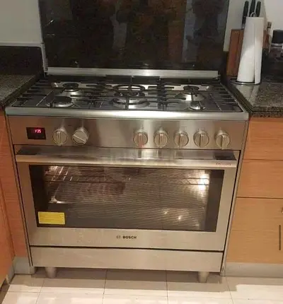 Bosch stainless steel freestanding gas range with electric oven - good condition