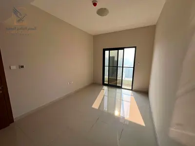 Annual apartment in Al Rashidiya, two bedrooms, spacious, central AC, two bathrooms, balcony and wa