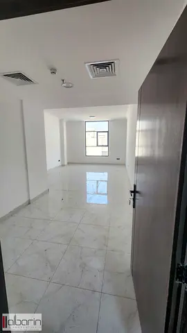 For rent in Ajman, Al Yasmeen area: a very spacious one-bedroom apartment with a living room—first-time occupancy.